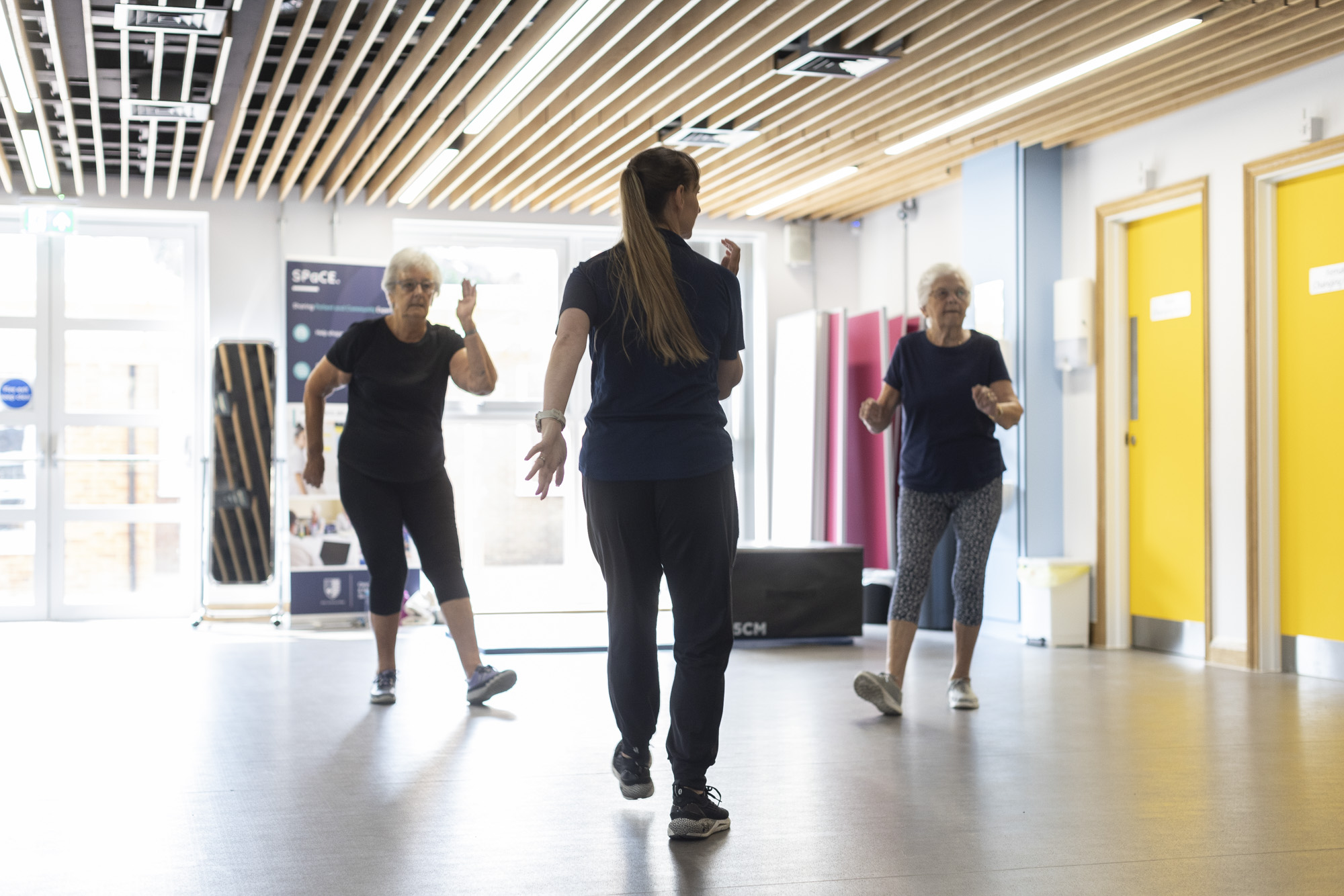 Sports Rehabilitator taking patients through a group exercise routine