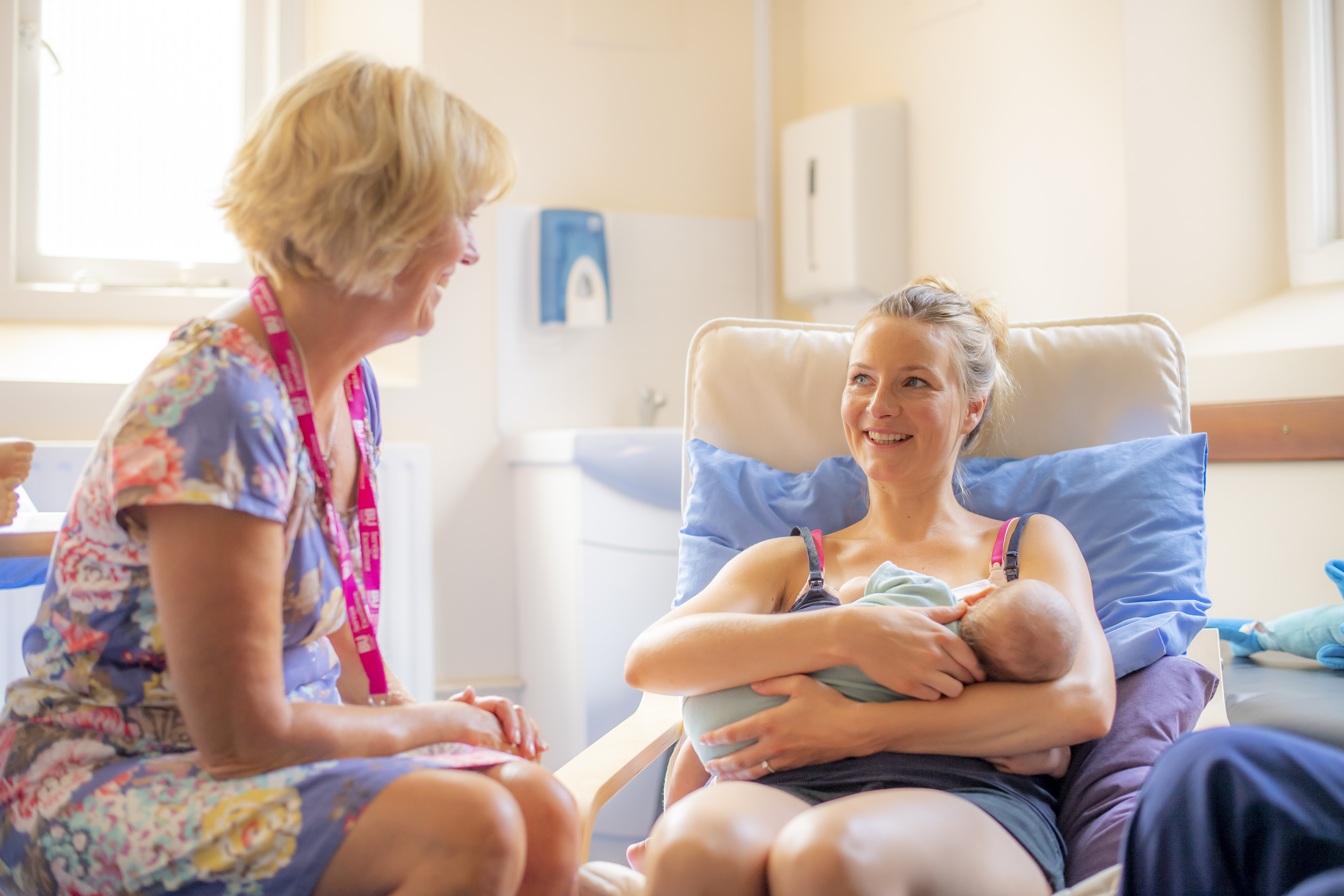 breastfeeding support with clinician and mother with baby