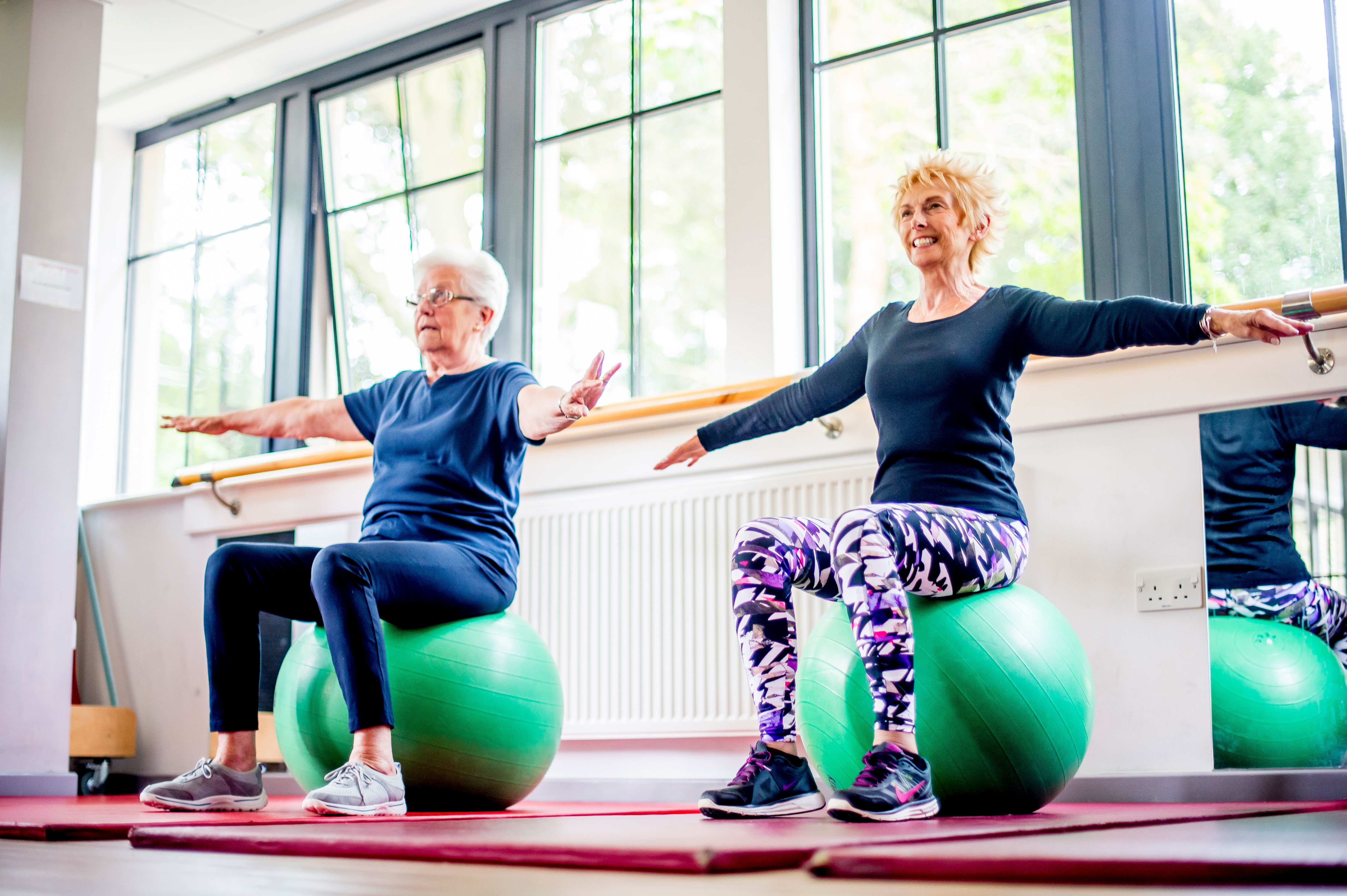 everyday exercise class with two patients using exercise balls