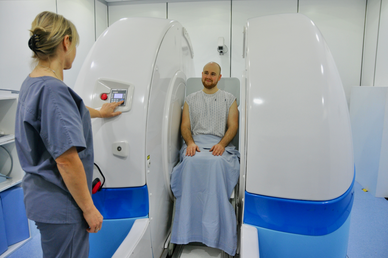 Man sitting in MRI machine