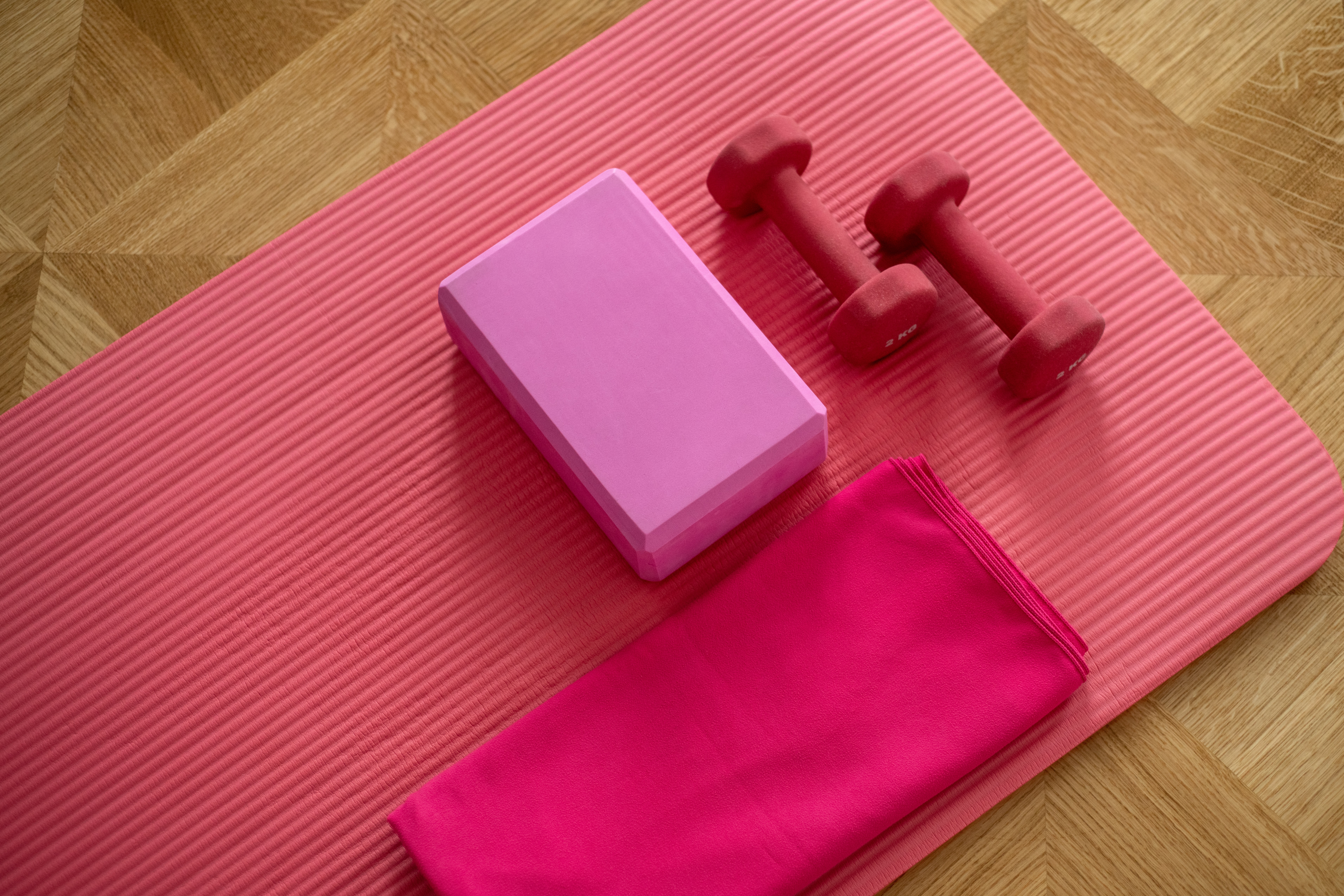 close up of yoga mat and small dumbbells